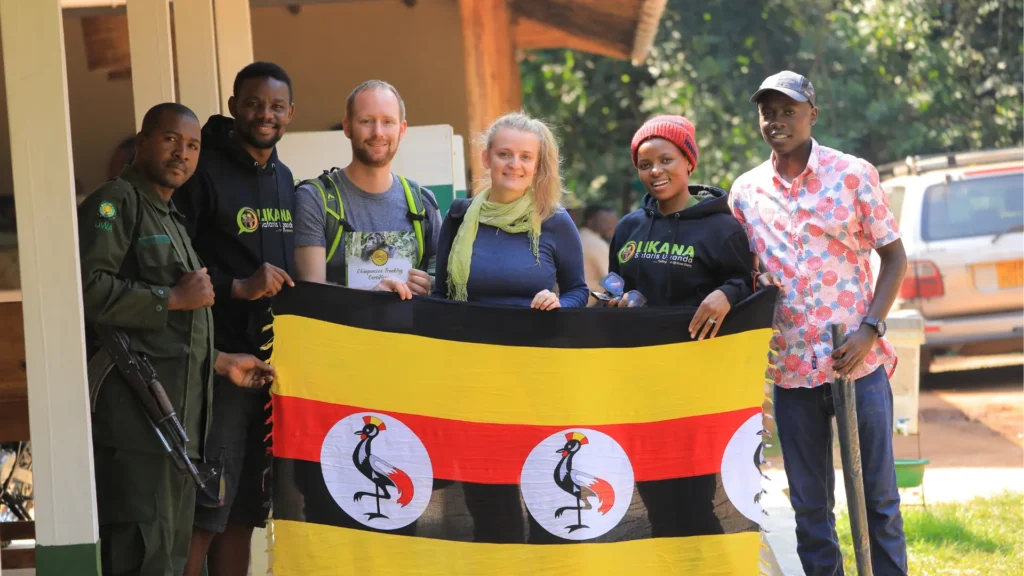 Tourists after Gorilla trekking pose for a photograph holding a certificate from Likana Safaris Uganda